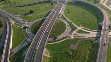 Aerial view of cars driving on round intersection in city, Transportation roundabout infrastructure, Highway road junction in Wroclaw, Poland