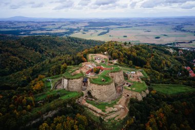 Srebrna Gora fortress and Sudety mountains at autumn season, aerial drone view. Military fort landmark for tourists in Lower Silesia, Poland clipart