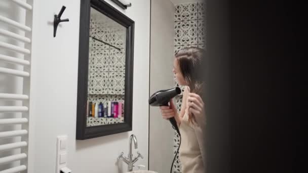 Woman Wrapped Towel Blow Drying Hair Standing Bathroom Female Morning — Stock Video