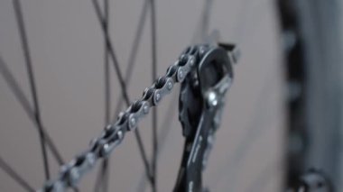 Chain rotates on the rear gearshift of the bike. Bicycle transmission maintenance