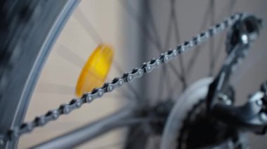 Cassette with gears and chain in motion on rear bicycle wheel. Maintenance bike transmition