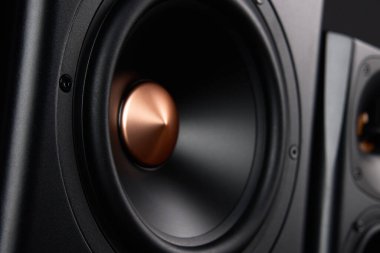 Sound speaker on dark background, close up. Set for listening music. Audio equipment