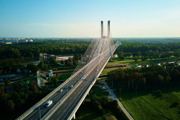 stock image Aerial drone view of Redzinski bridge over Odra river in Wroclaw city, Poland. Large cable stayed bridge with car traffic in european city, bird eye view. Transportation infrastructure and logistic