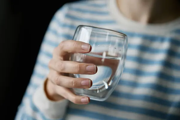 Woman drinks water, Close-up shot of woman drinking fresh clean water from glass, Quenching thirst, Lifestyle healthcare concept
