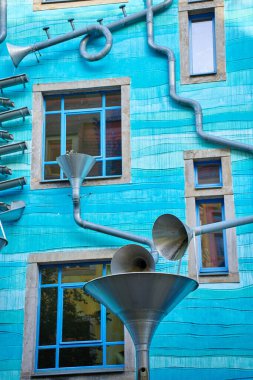 Kunsthofpassage in Neustadt district of Dresden, Germany. Quirky facade of residential building featuring musical instrument. Dresden, Germany - May 4, 2024 clipart