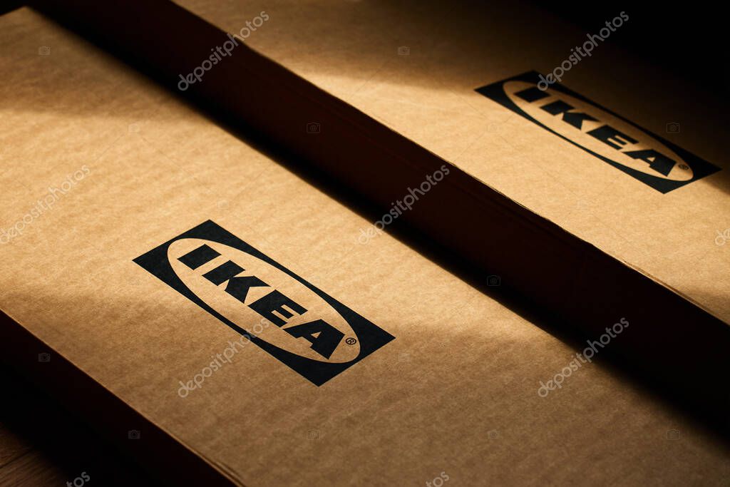 Close-up of IKEA cardboard packaging boxes with brand logo in sunlight. Home furniture assembly. Wroclaw, Poland - May 25, 2025