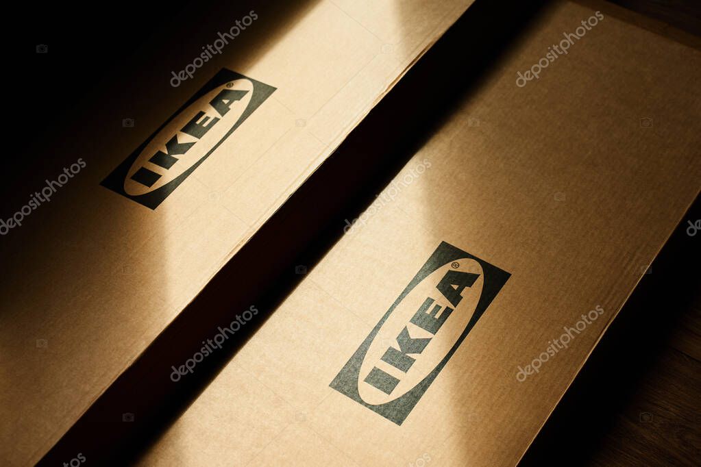 Close-up of IKEA cardboard packaging boxes with brand logo in sunlight. Home furniture assembly. Wroclaw, Poland - May 25, 2025