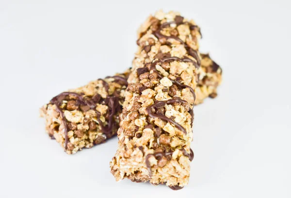Two cereal fitness bars on a white background.Close-up.