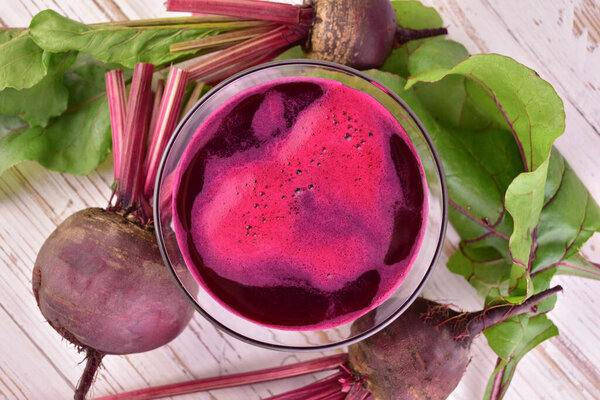 Beetroot juice in a glass. Useful healing drink. Flat lay.