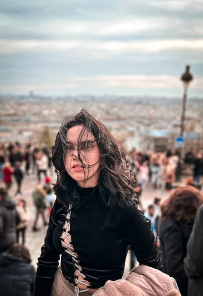 Young lady at Monmartre.Montmartre is a 130-meter hill in the north of Paris and an ancient Roman settlement.