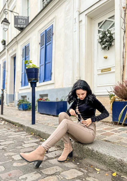 Young lady at Monmartre.Montmartre is a 130-meter hill in the north of Paris and an ancient Roman settlement.