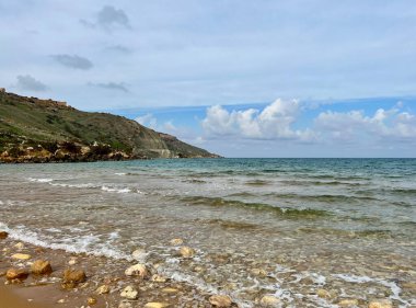 Beautiful sandy beach on the Coast of the island of Gozo, Malta. The Mediterranean Sea. clipart