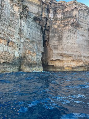 Blue caves on the island in Xlendi Bay on the island of Gozo  Malta clipart