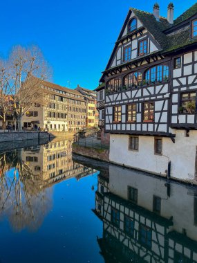 Historic buildings in Petite France district of Strasbourg, France. Old houses on the banks of the river Rhine in Strasbourg, France. 