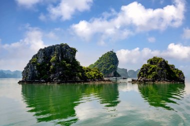 Ha Long Bay landscape with tourist boats and beautiful mountains. It has been recognized by Unesco as a World Natural Heritage many times. It located in Ha Long, Quang Ninh province, Vietnam.