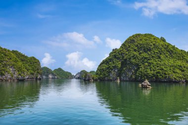 Ha Long Bay landscape with tourist boats and beautiful mountains. It has been recognized by Unesco as a World Natural Heritage many times. It located in Ha Long, Quang Ninh province, Vietnam.