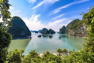 Ha Long Bay landscape with tourist boats and beautiful mountains. It has been recognized by Unesco as a World Natural Heritage many times. It located in Ha Long, Quang Ninh province, Vietnam.