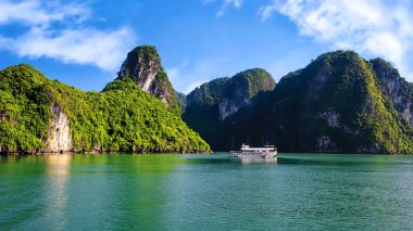 Ha Long Bay landscape with tourist boats and beautiful mountains. It has been recognized by Unesco as a World Natural Heritage many times. It located in Ha Long, Quang Ninh province, Vietnam.