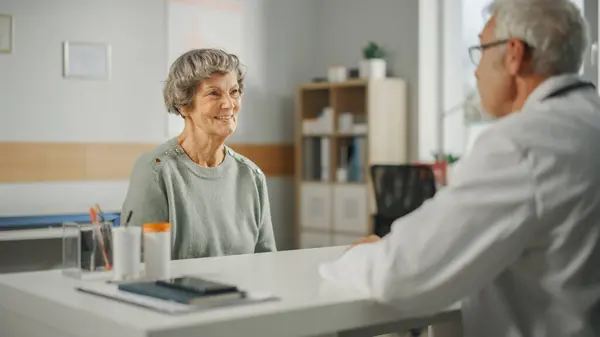 Middle Aged Family Doctor Talking Senior Female Patient Consultation Health — Stock Photo, Image