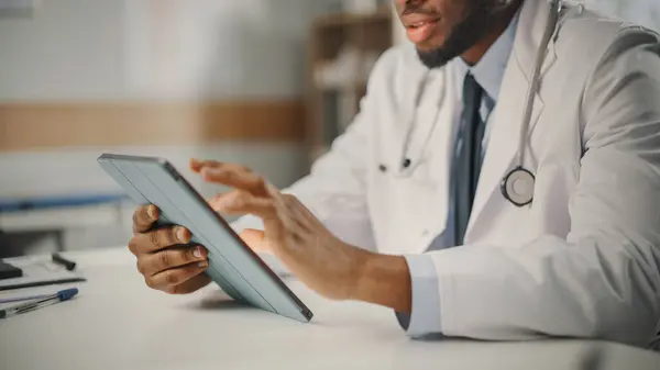 Close African American Male Doctor Wearing White Coat Working Tablet —  Fotos de Stock