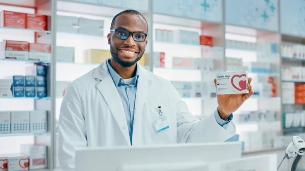 Pharmacy Drugstore Portrait Professional Black Male Pharmacist Holding Package Heart — Stock Photo, Image