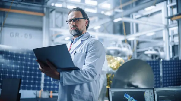 Male Engineer Confident Focused Thinking Working Laptop Aerospace Satellite Manufacturing — Stock Photo, Image