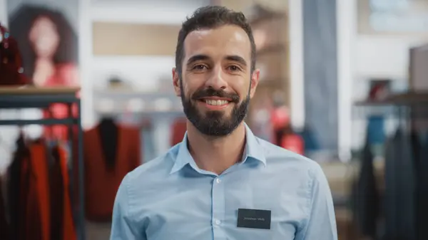 Portrett Happy Handsome Store Assistant Blue Shirt Smiling Posing Camera – stockfoto