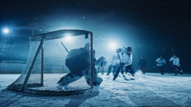 Buz hokeyi sahası: Forward Player 'a karşı Slapshot atan, Puck' ı sopayla vuran ve gol atan kaleci. Kaleciye karşı iletici.