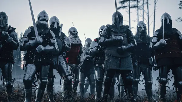 stock image Epic Armies of Medieval Knights on Battlefield Clash, Plate Body Armored Warriors Fighting Swords in Battle. Bloody War and Savage Conquest. Historical Reenactment. Cinematic Shot