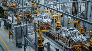 Otomatik Robot Silahlanma Hattı Yüksek Teknolojik Yeşil Enerji Elektrikli Araçlar Üretimi. İnşaat, Bina, Kaynak Endüstrisi Üretim Taşıyıcısı. Yükseltilmiş Geniş Görüş