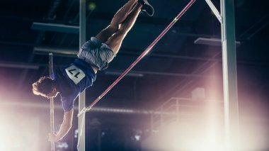 Polonyalı Atlama: Profesyonel Erkek Sporcu Dünya Şampiyonası 'nda Pole Over Bar ile Başarıyla Atlıyor. Spor Başarı Deneyimi ile Büyük Stadyum Yarışması Atışı