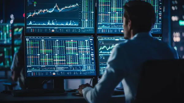 Financial Analysts Day Traders Working Computers Multi Monitor Workstations Real — стоковое фото