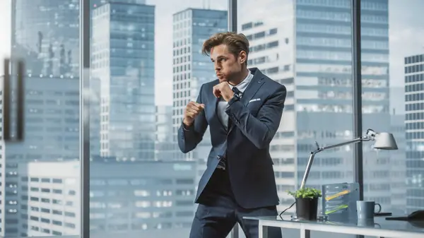 Spent Handsome Businessman Jumps Office Punches Air Success Young Ceo – stockfoto