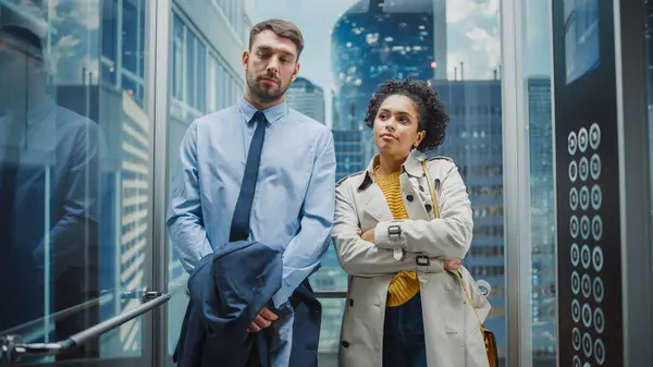 Two Office Colleagues Riding Glass Elevator Modern Business Center Way — Stock Photo, Image