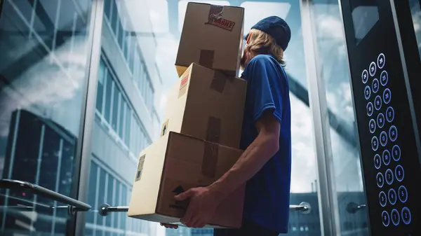 Young Delivery Person Riding Glass Elevator Modern Office Building Mail — Stock Photo, Image