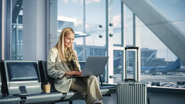 Airport Terminal Smiling Woman Waits Flight Uses Laptop Browse Internet Стокове Зображення