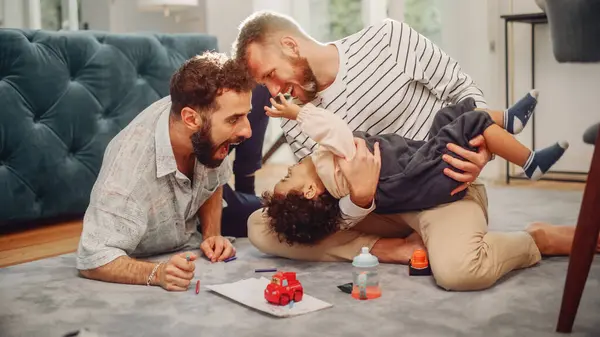 Loving Lgbtq Family Playing Toys Adorable Baby Boy Home Living Royalty Free Stock Images