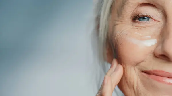 Close Portrait Beautiful Senior Woman Applied Eye Face Cream Elderly — Stock Photo, Image