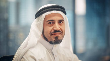 Portrait of Successful Arab Businessman in Traditional Outfit Gently Smiling, Wearing White Kandura and Black Agal Keeping a Ghutra in Place. Saudi clipart