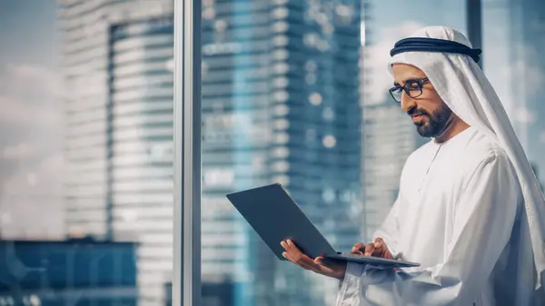 Successful Muslim Businessman Traditional White Kandura Standing His Modern Office Royalty Free Stock Images