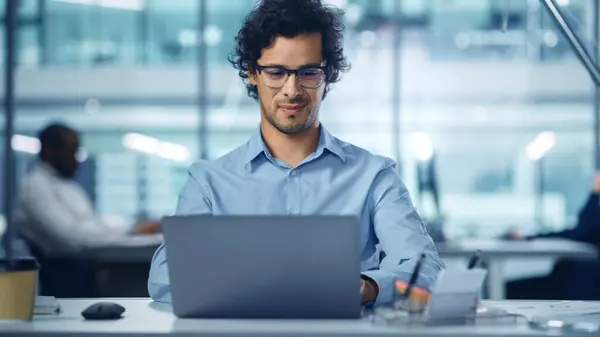 Modern Office Businessman Working Computer Portrait Successful Latin Software Engineer ภาพสต็อก