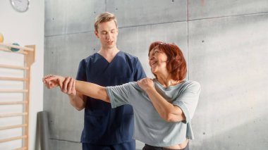 Professional Sport Physiotherapist Working on Specific Muscle Groups and Back Pain with Middle Aged Sporty Female. Senior Woman Recovering from Mild