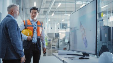 Factory Office Meeting: Engineer Talking with Industrial Parts Supplier About a Business Venture and Collaboration on Next Generation Hydraulics