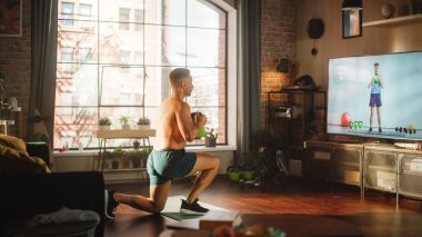 Home Training: Handsome Black Man Using Kettlebell Situps, Exercising with Personal Trainer via TV Online Video App. Mixed Race Sportsman Using