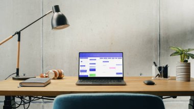 Laptop Computer with Software Platform Screen Display Standing on a Desk. Efficiently Minimalistic Design of Modern Office Space. Business, Scheduling
