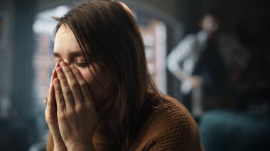 Portrait of Sad Crying Woman being Harrased and Bullied by Her Partner. Couple Arguing and Fighting Violently. Domestic Violence and Emotional Abuse