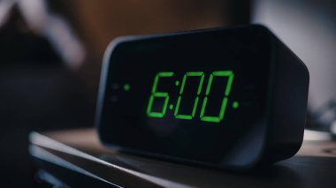 Person Wakes Up and Turns off Alarm Clock. Early Rising Productive Person Ready Start a Day with New Adventures. Close-up Focus on the Clock Showing