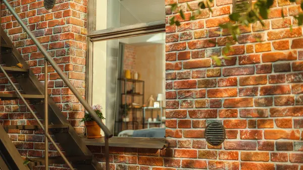 stock image Establishing shot: A shot of a Window of a Cozy Brownstone House Apartment Taken from a Staircase Outside the House. Apartment Creatively Decorated in