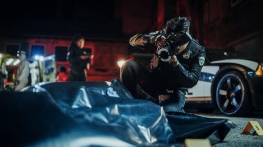 Policeman Taking Photos of Bagged Corpse Found Murdered in a Back Alley at Night. Police Officer at Crime Scene Documenting the Victims Body. Death clipart