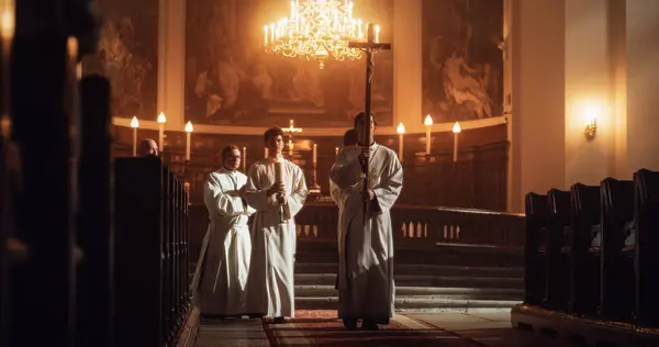 stock image Liturgy In Church: Procession Of Ministers, Bearing Holy Cross from Altar, As Congregation Stands In Wonder. Christians Rejoice In Celebration Of